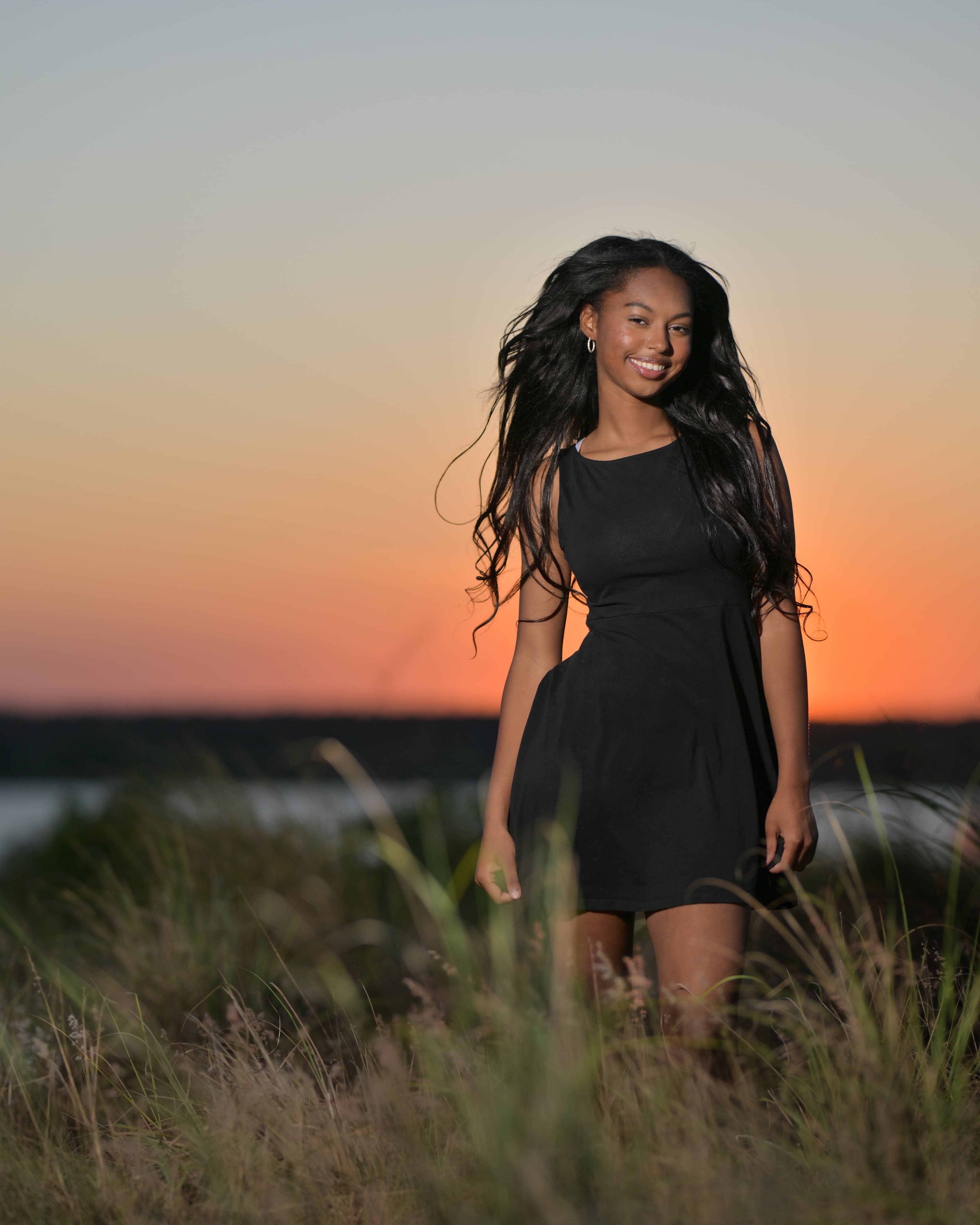 Janae Johnson at golden hour, hair caught mid-movement